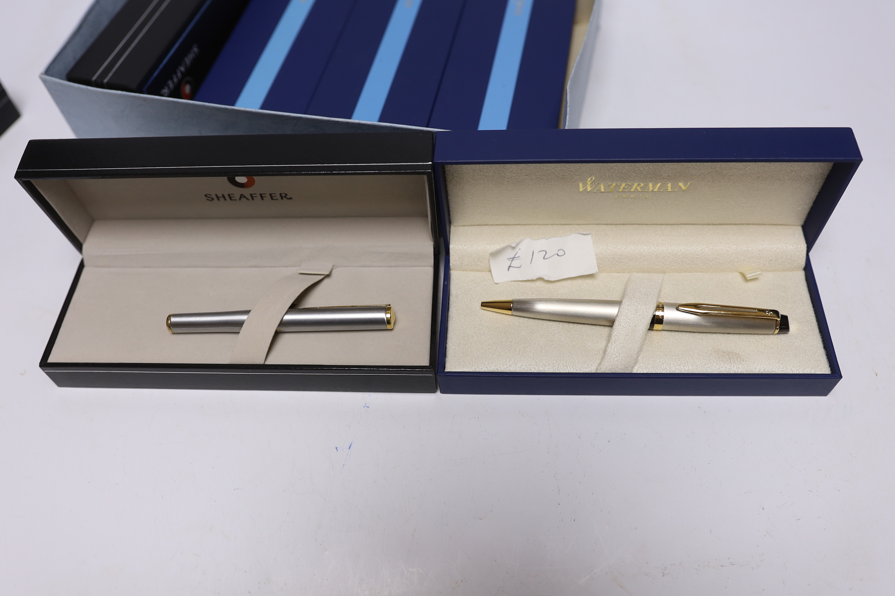 Eight boxed Waterman and Sheaffer pens; two Expert Ballpoint pens, two Hemisphere Ballpoint pens, a Hemisphere Rollerball pen, and three Sheaffer 300 series Ballpoint pens